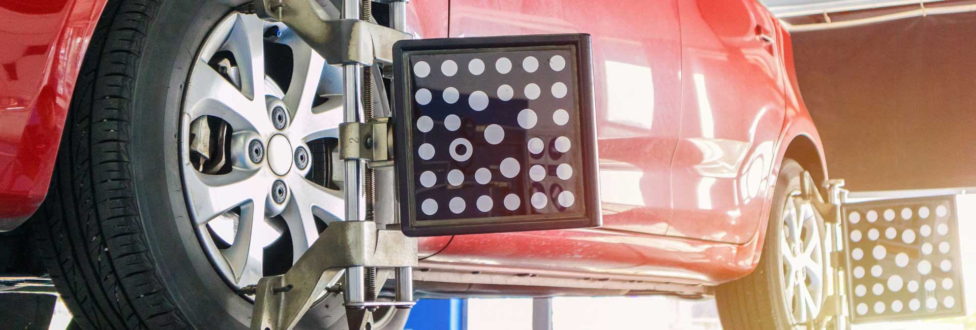 Vehicle on Lift for Tire Maintenance